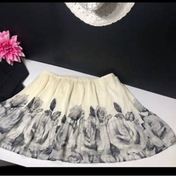 Elle Dresses & Skirts - Elle Pleated Skirt Cream with black floral Size Large